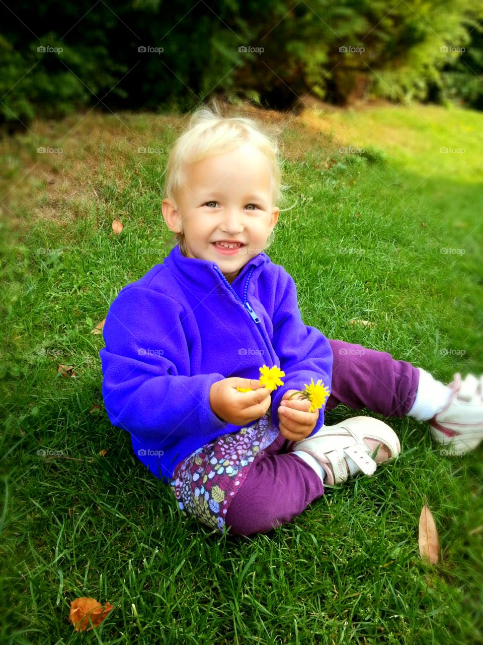 Girl with yellow flowers in her hand