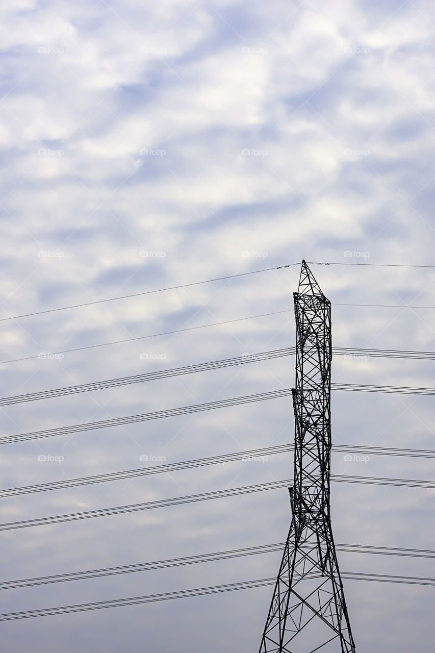 The high voltage poles background of the  sky.