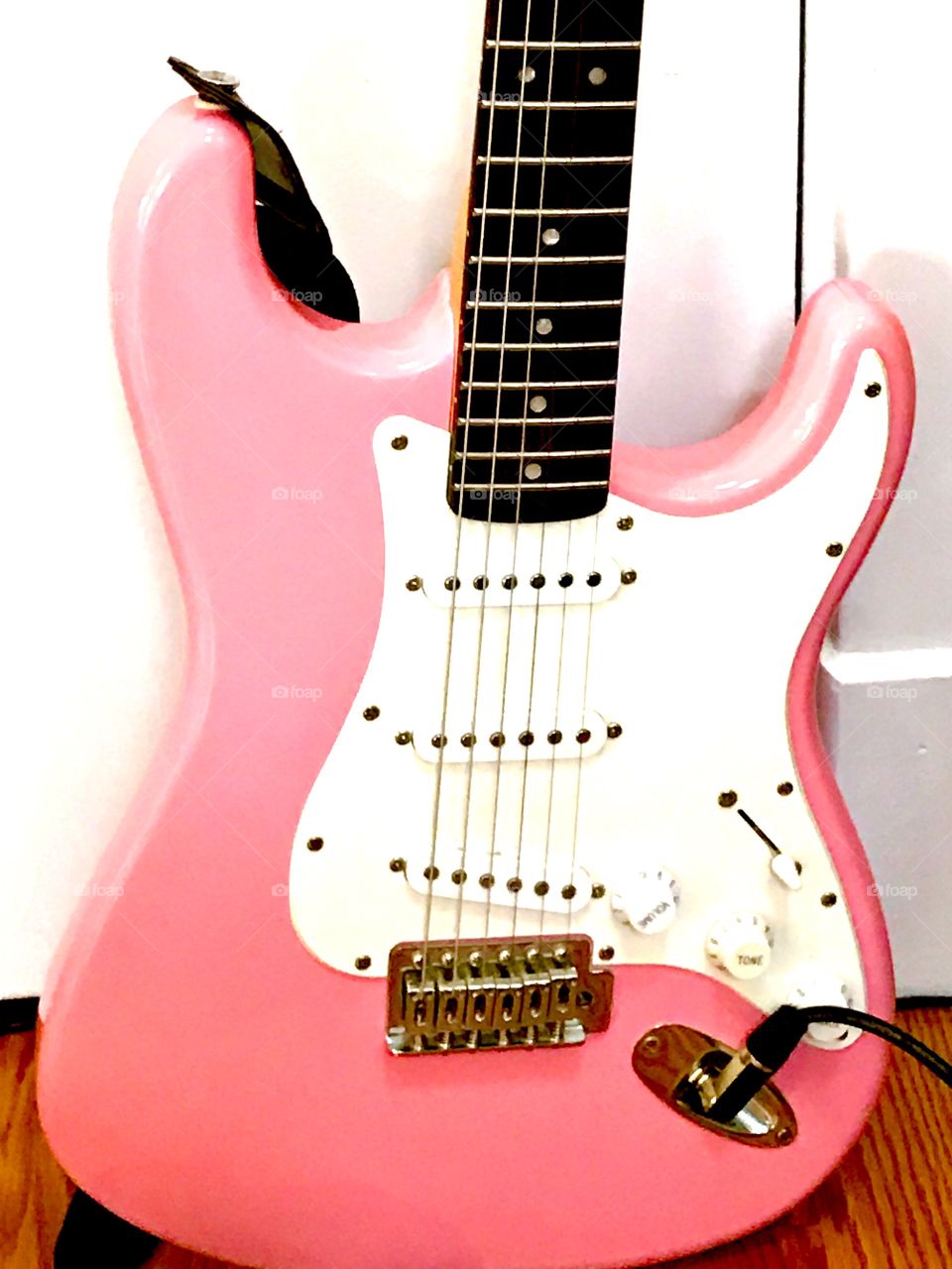 Pink electric guitar