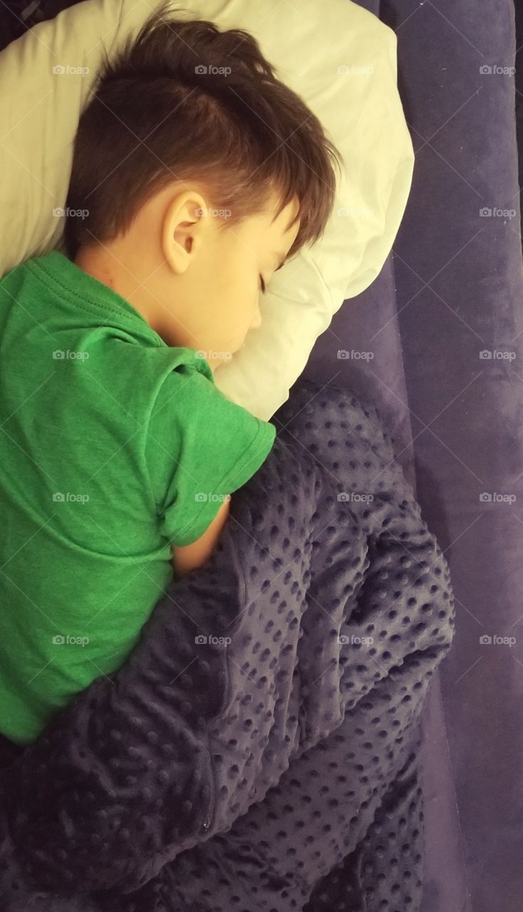 sleeping like a baby with his new weighted blanket!
