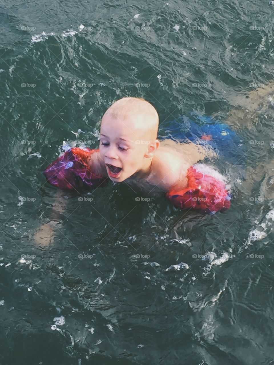 Boy bathing in the ocean