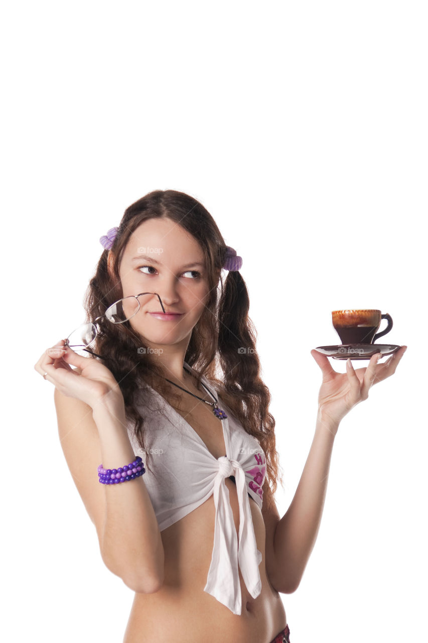 Girl with a coffee cup dreams. Isolated over white.