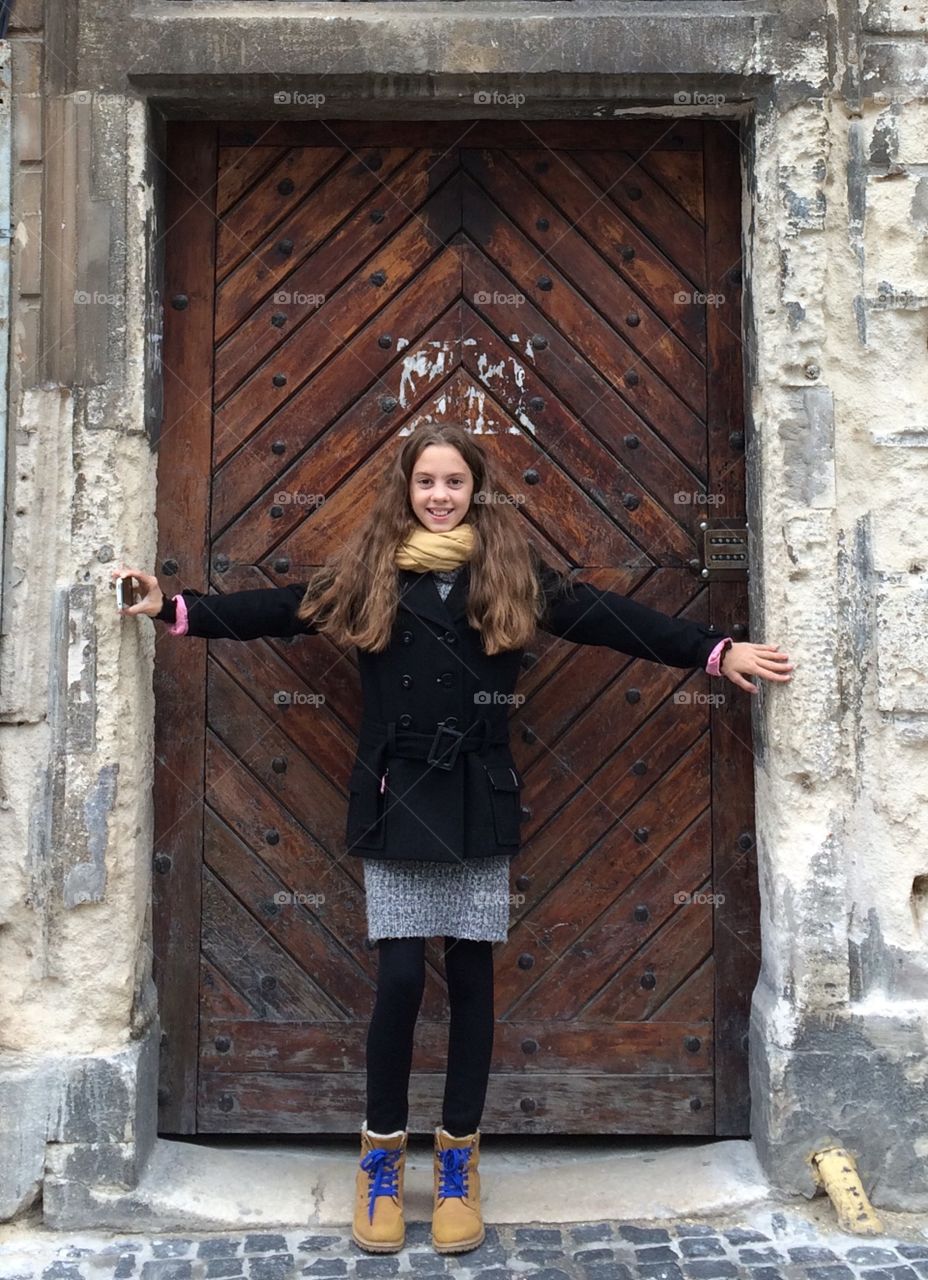 Smiling girl at the door