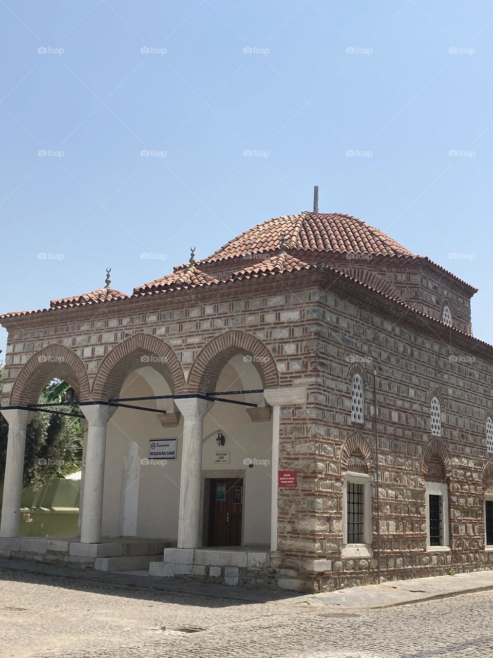 Beach time on holidays. Blue sky and tall palm trees. Sunsets and sunny days. Summertime in Kusadasi. Vacation travel in Turkey . Summer view. Sunny day during vacation 
