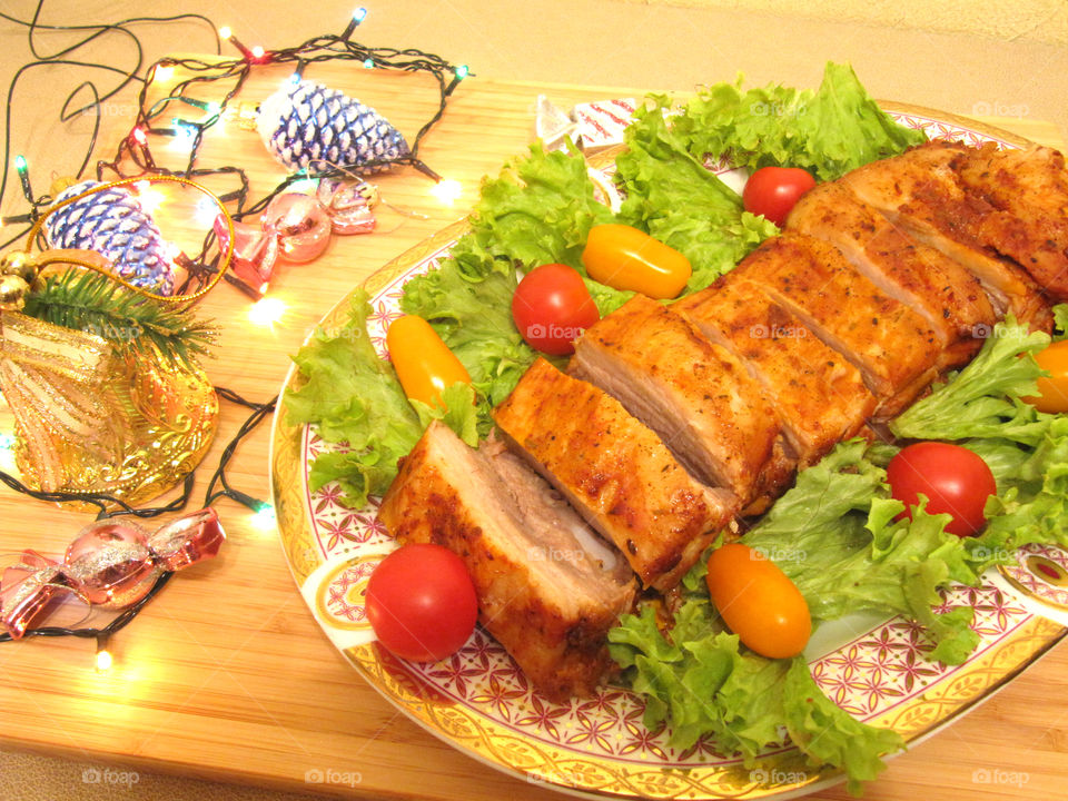 Tasty meat ribs with fresh red and yellow tomatoes