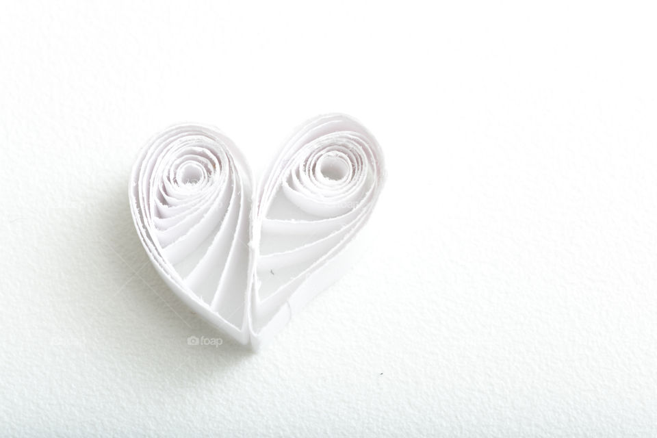 White paper heart on white