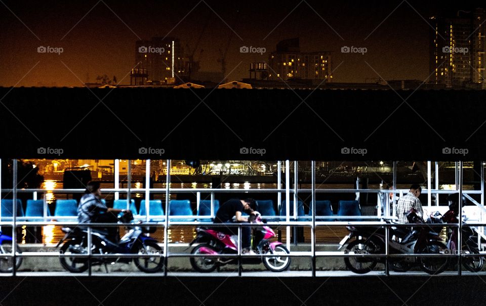 Biker’re waiting to cross the big river