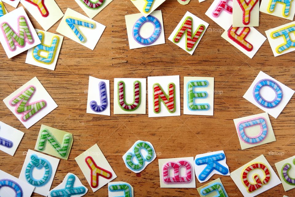 the word june. the word june spelled in colorful letters