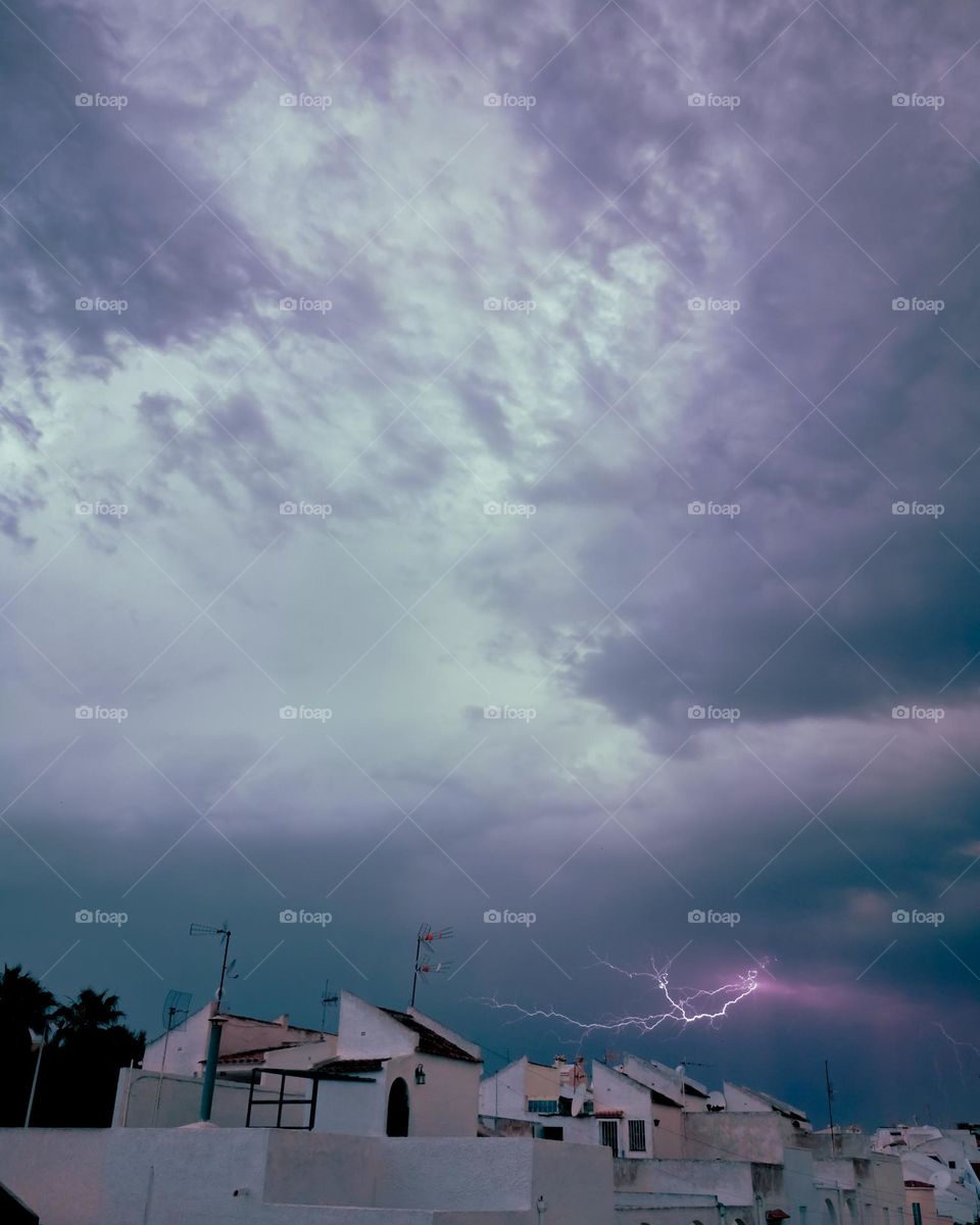 Lightning over rooftops