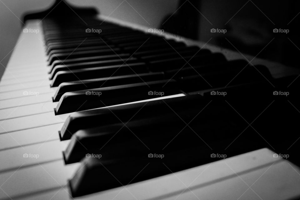 Black and white close up piano keyboard.
