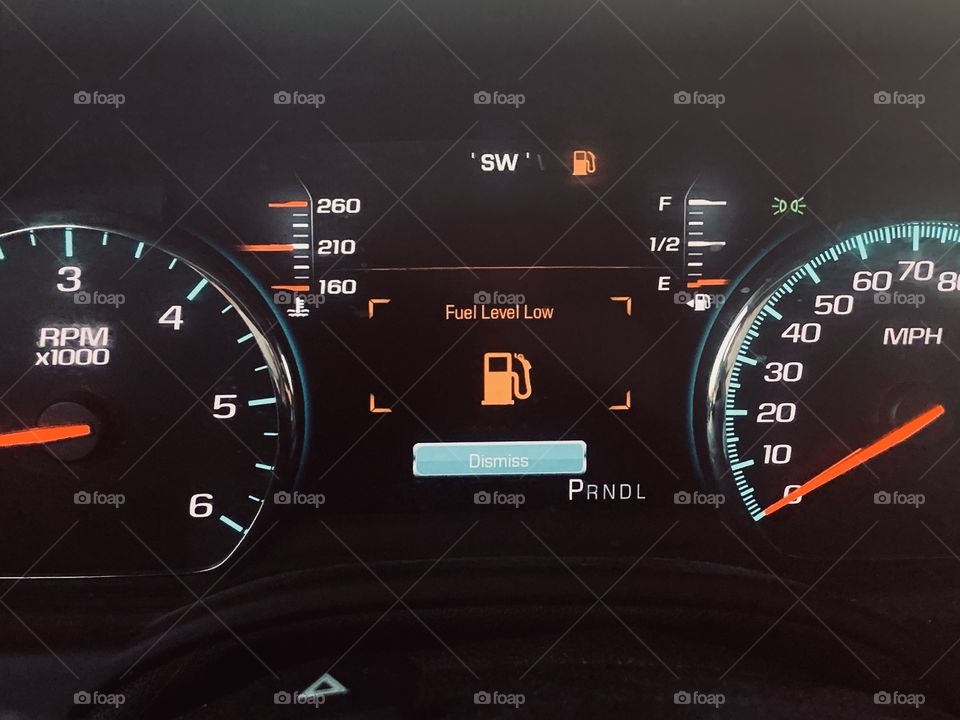 Fuel range low in car - orange light appears when fuel tank is low on gas 