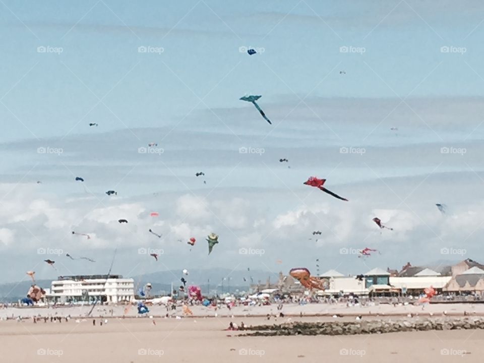 John Smalley. . Kite festival from a distance. Morcambe sea front 