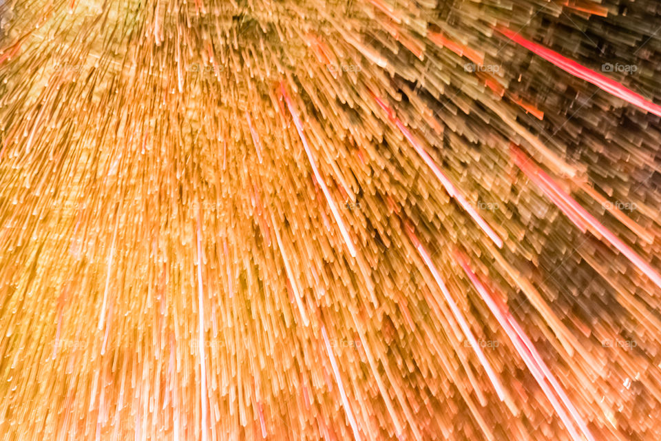 Fireworks light up and light painted in shapes with sparkler At night. Abstract motion blur messy Painting with light trail for abstract background.