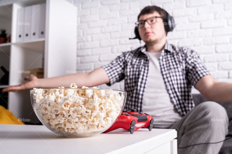 young emotional man playing video games