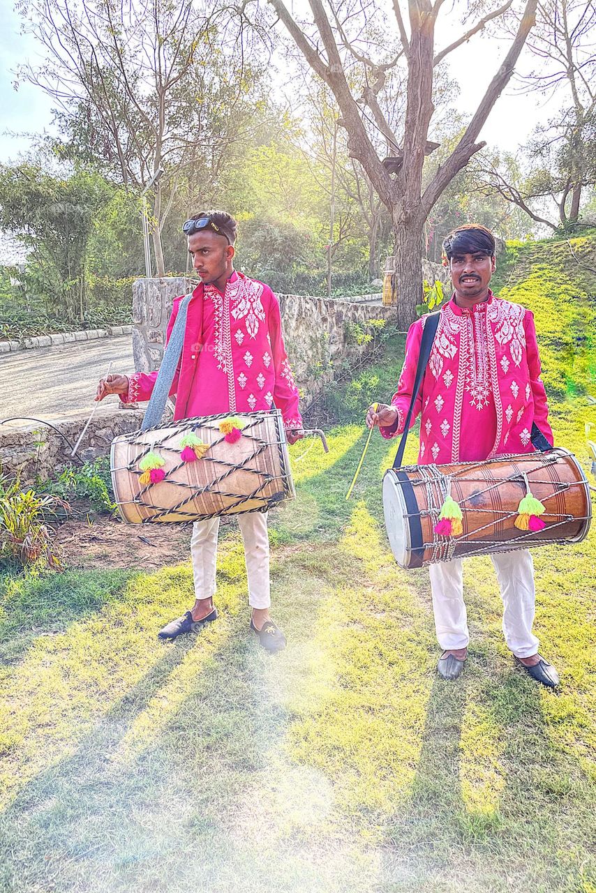 Indian drummers at the wedding, celebrating the wedding, Indian ceremony in India, drummers drumming, colorful culture of India 