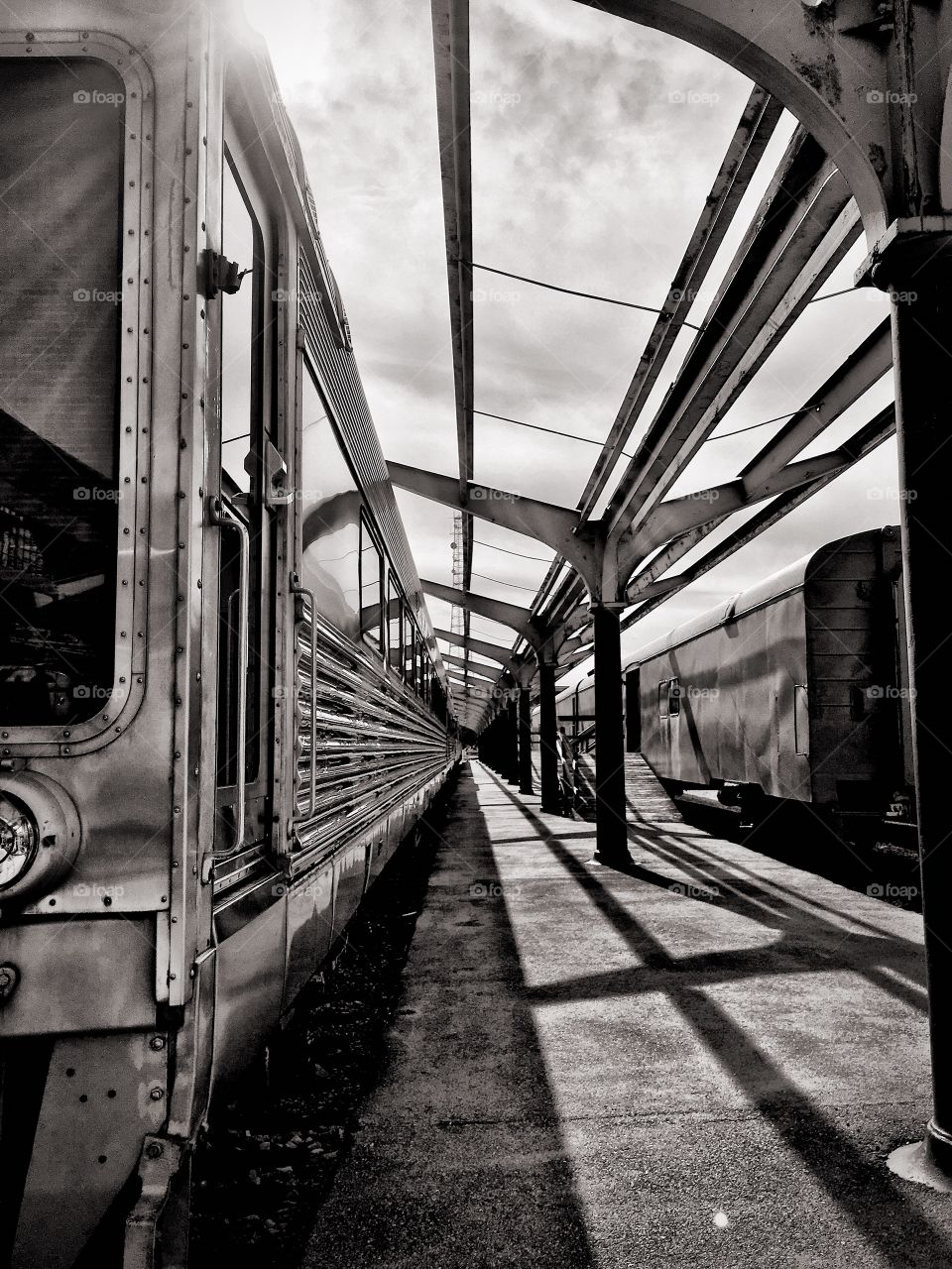 This is a black and white photograph I captured at the train station, at the coliseum in Saint Louis Missouri. I’m fascinated by shadows, and also like the modern feel along with the perspective shot of the train. 