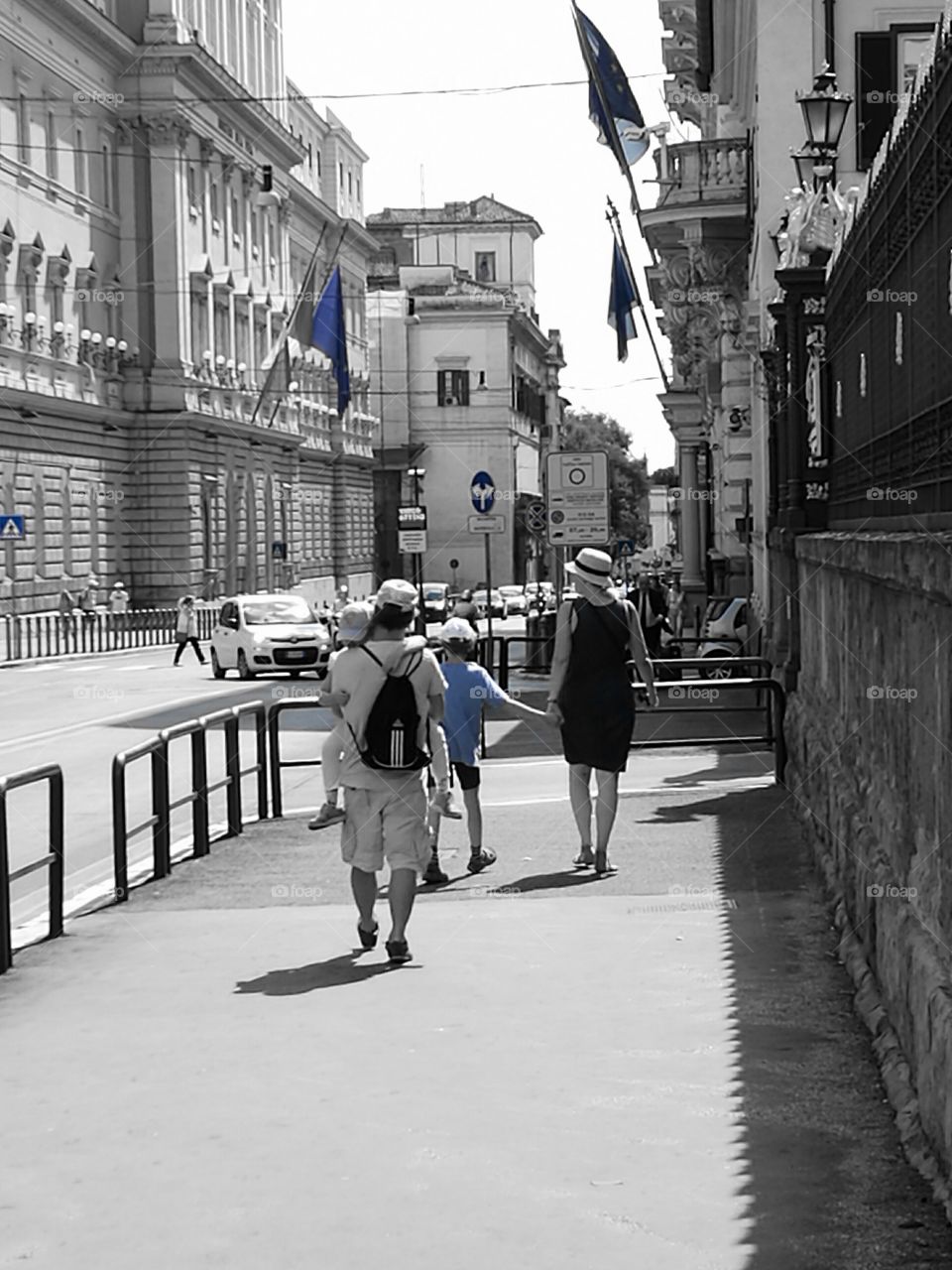 Family walking in the beautiful street