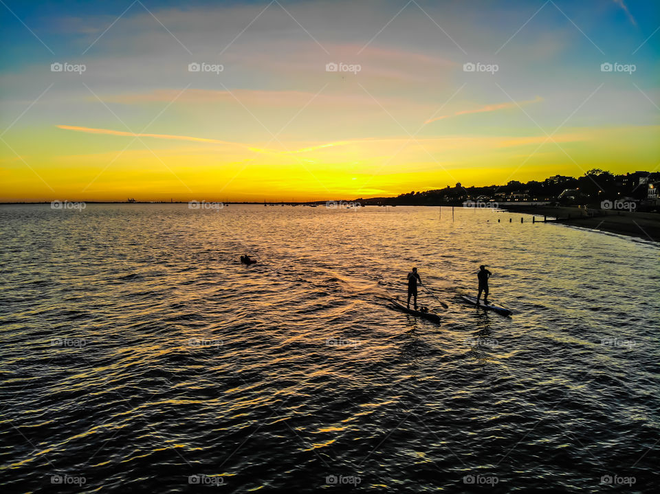 paddleboarding the sunset