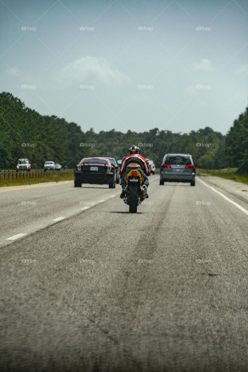 A bike from behind on the freeway