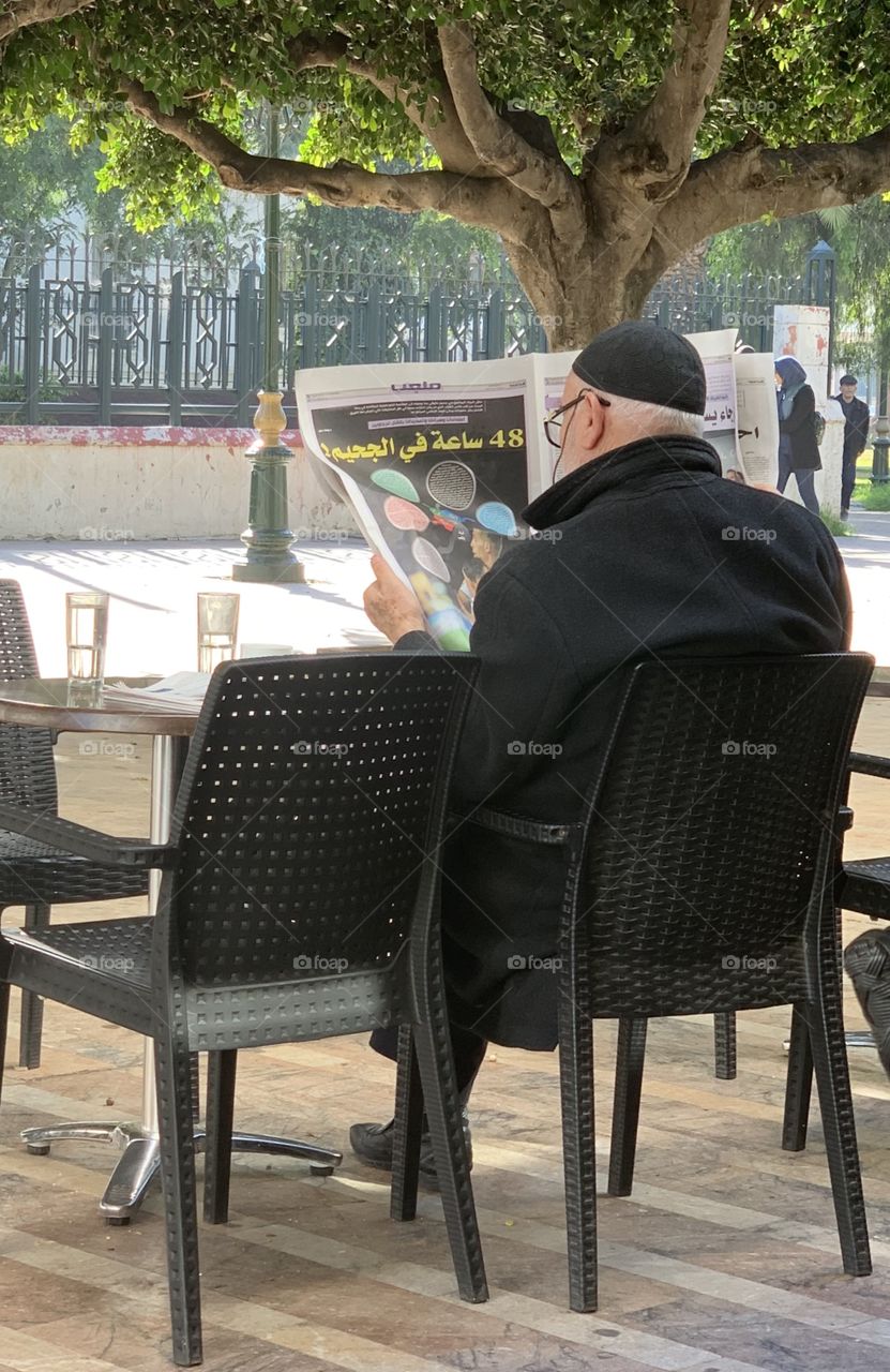 Old man read a newspaper 