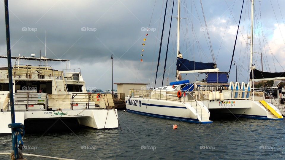 Catamaran sailing parade. Catamaran sailing in Maui Hawaii 