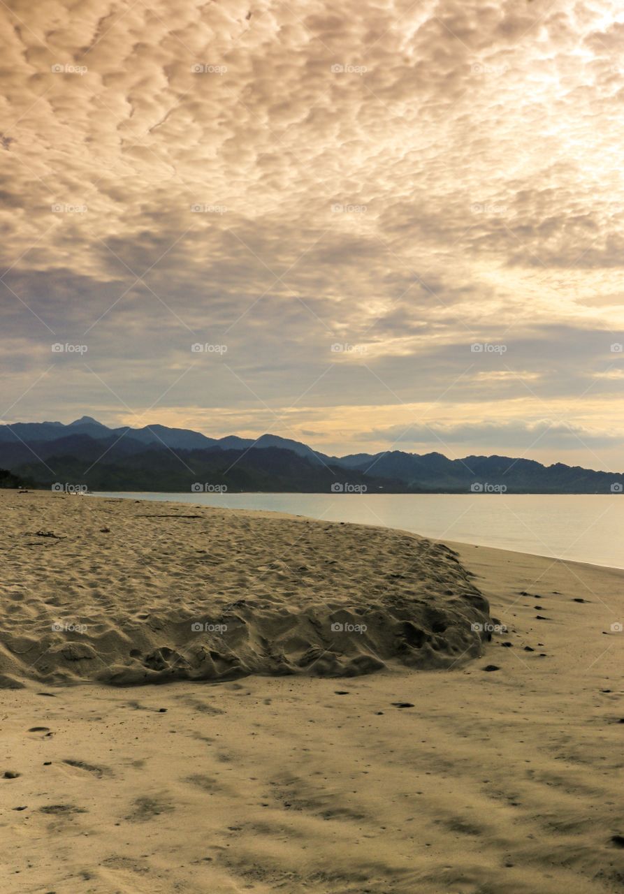 Sunrise at the beach with the Formations of low clouds