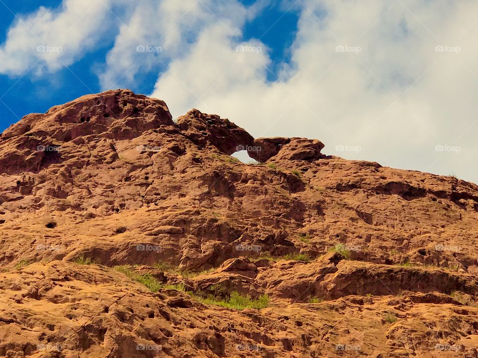 The kissing camels from below at Garden of the gods in Colorado Springs on a beautiful summer afternoon. Garden of the gods is the perfect place for a hike, walk, bike, run and they even have rock climbing spots available.