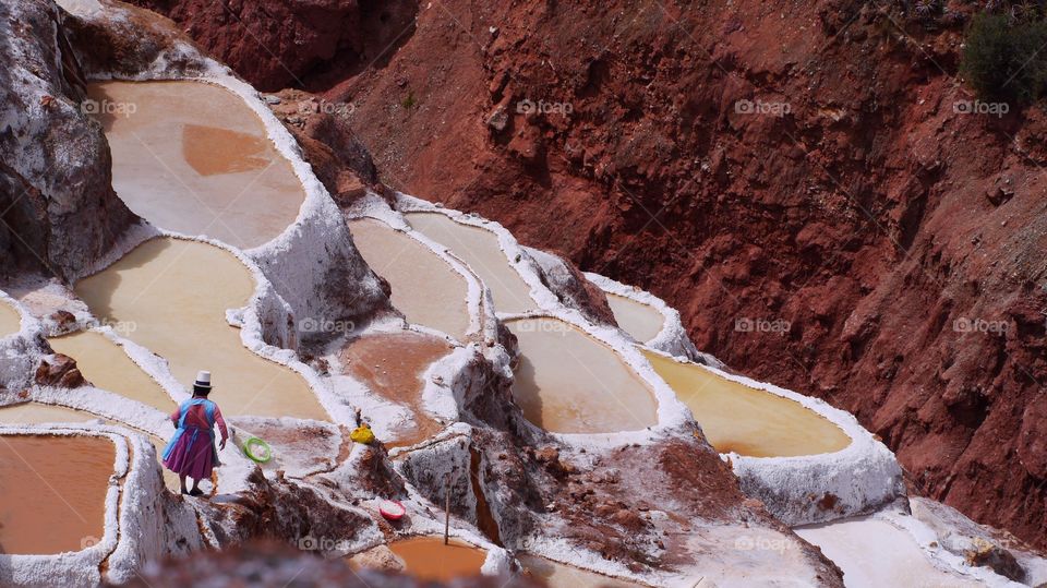 Woman at work,
Pink saline, Peru 