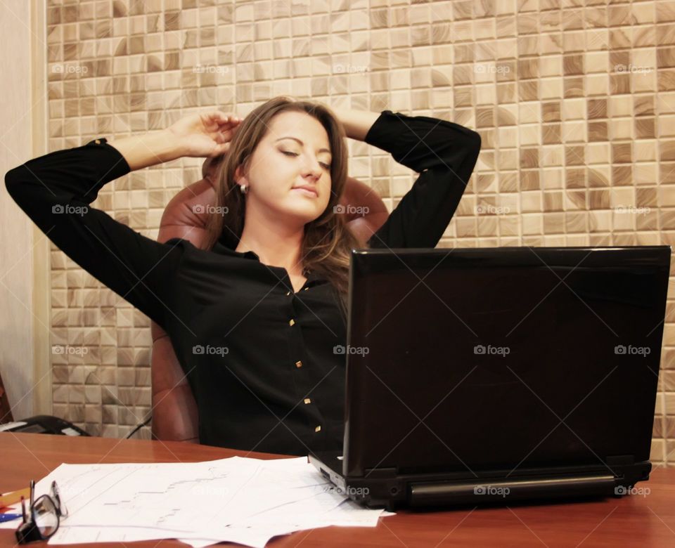 Business woman. Business woman is relaxing in office