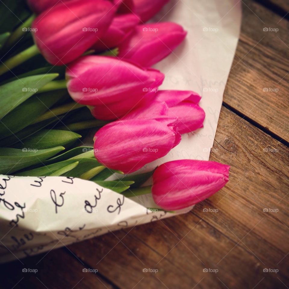Tulip flowers on table