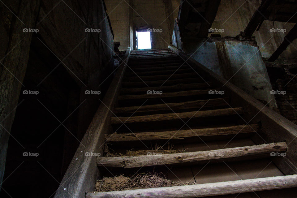 Stairs of the fear.... Old broken wooden stairs in abandoned building