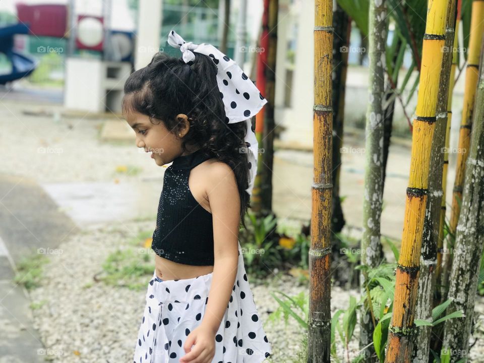 Girl with black and long curly hair 