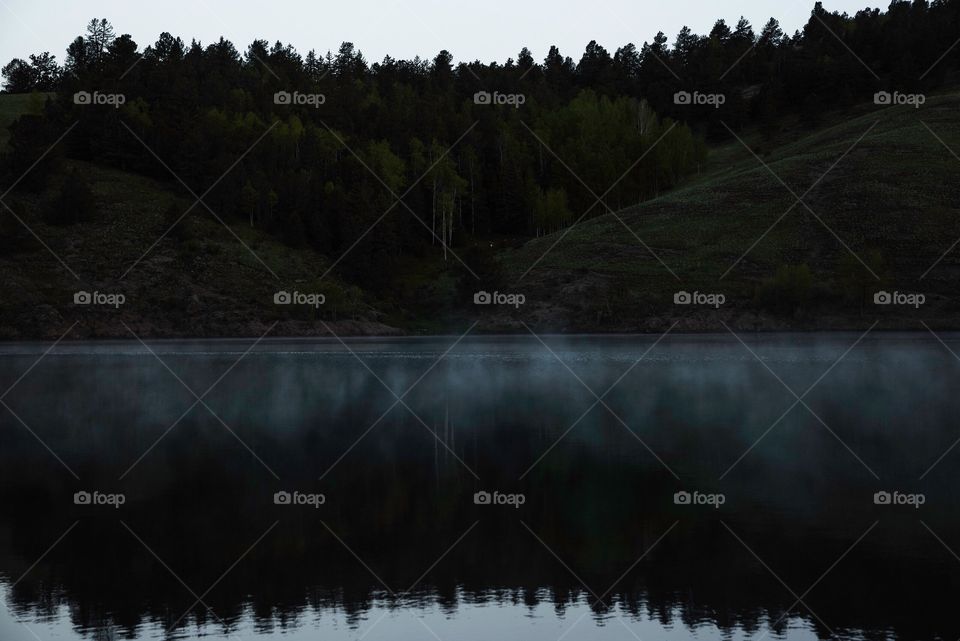 Early morning mist above lake