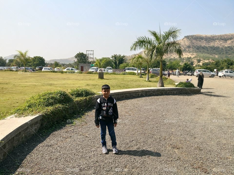 my son mehran standing in front of his school entry gate