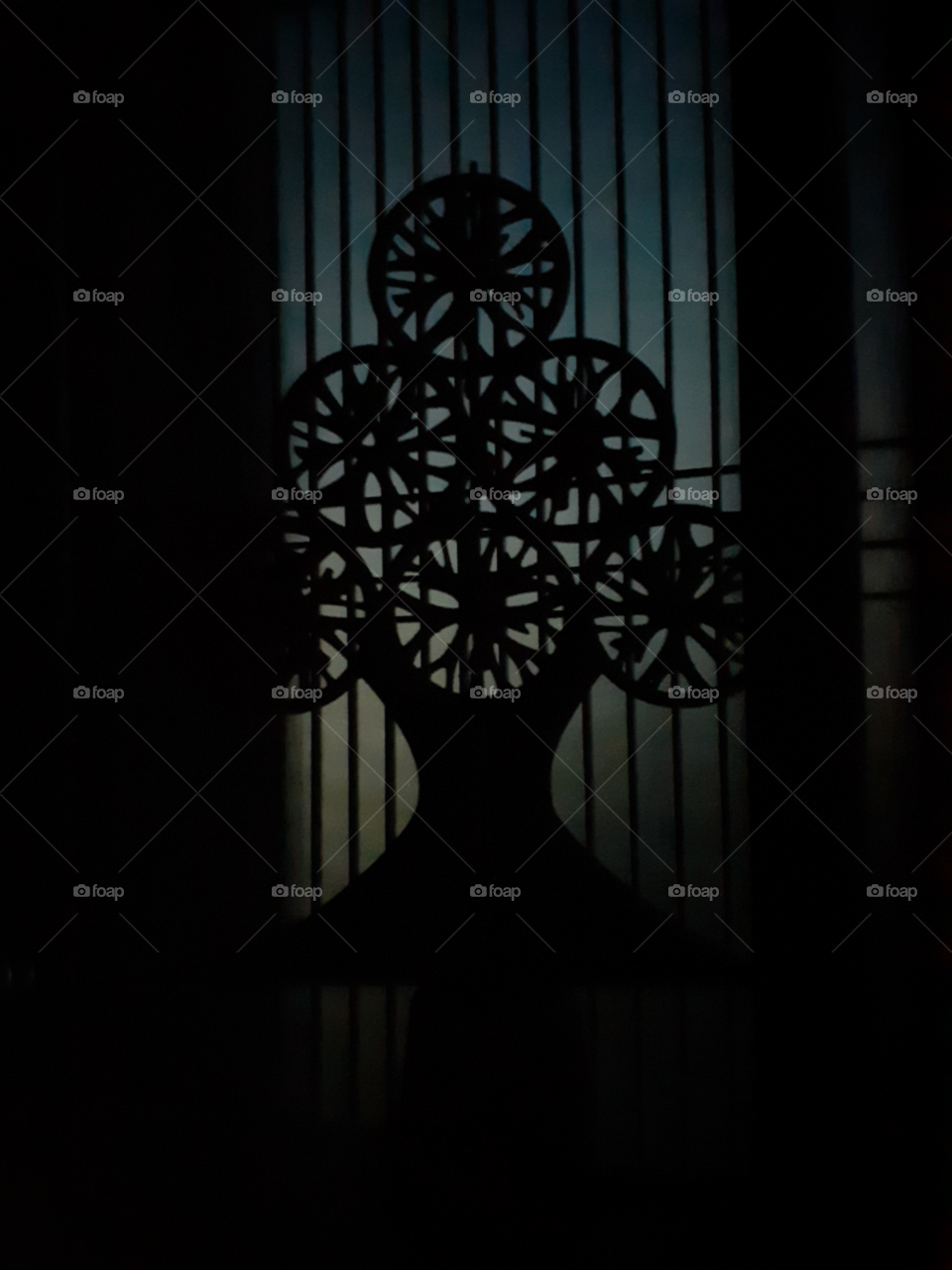 the little snow flakes christmass tree which is made of  cartoons. it is in front side. with the help of the little light outside the window. i made a very Beautiful  and clear  shadow of it.