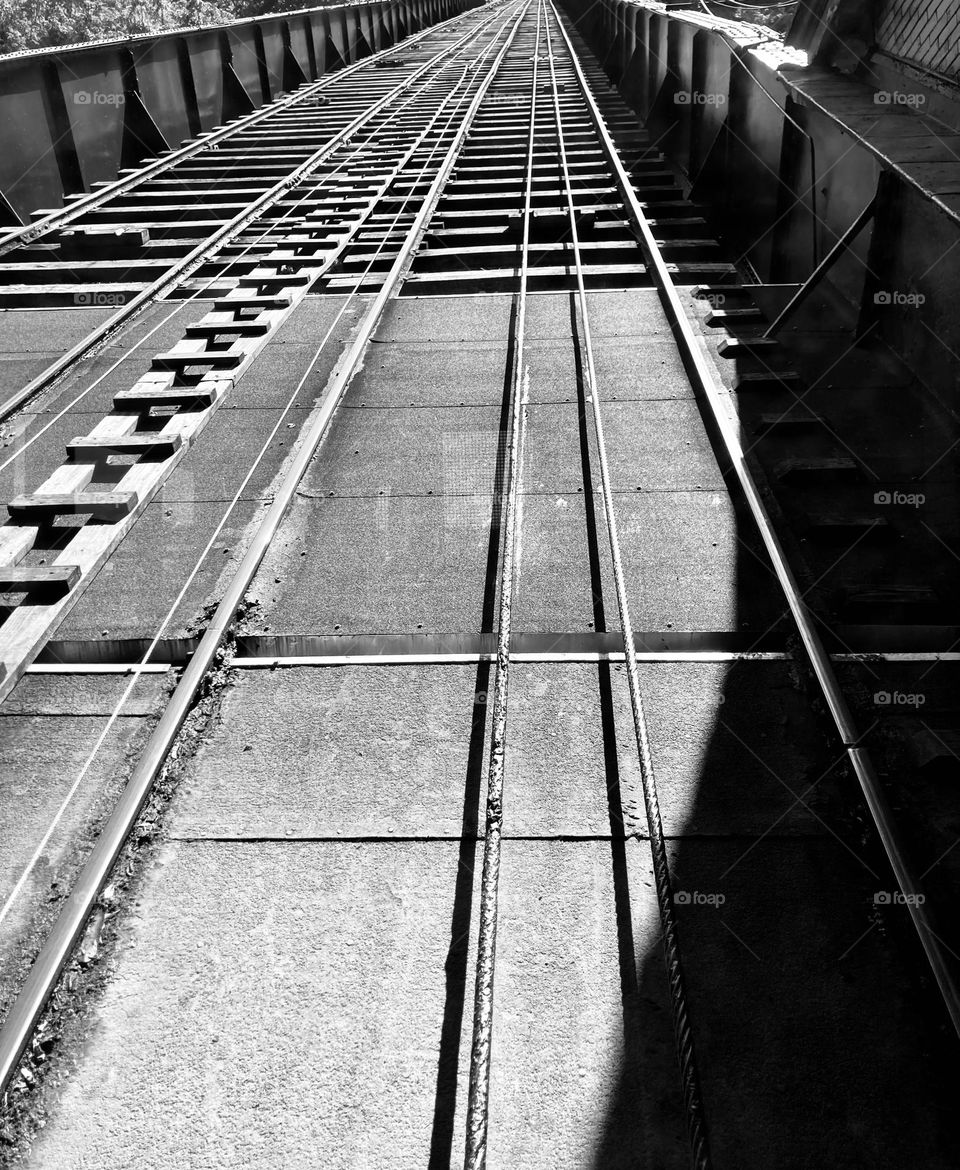 Black and white image of funicular tracks and cable of the Duquesne Incline in Pittsburg, Pennsylvania 