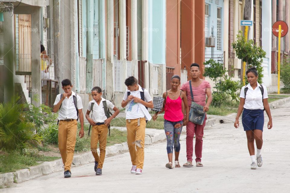 Cuban People.School children walking along a street in Guantanamo.