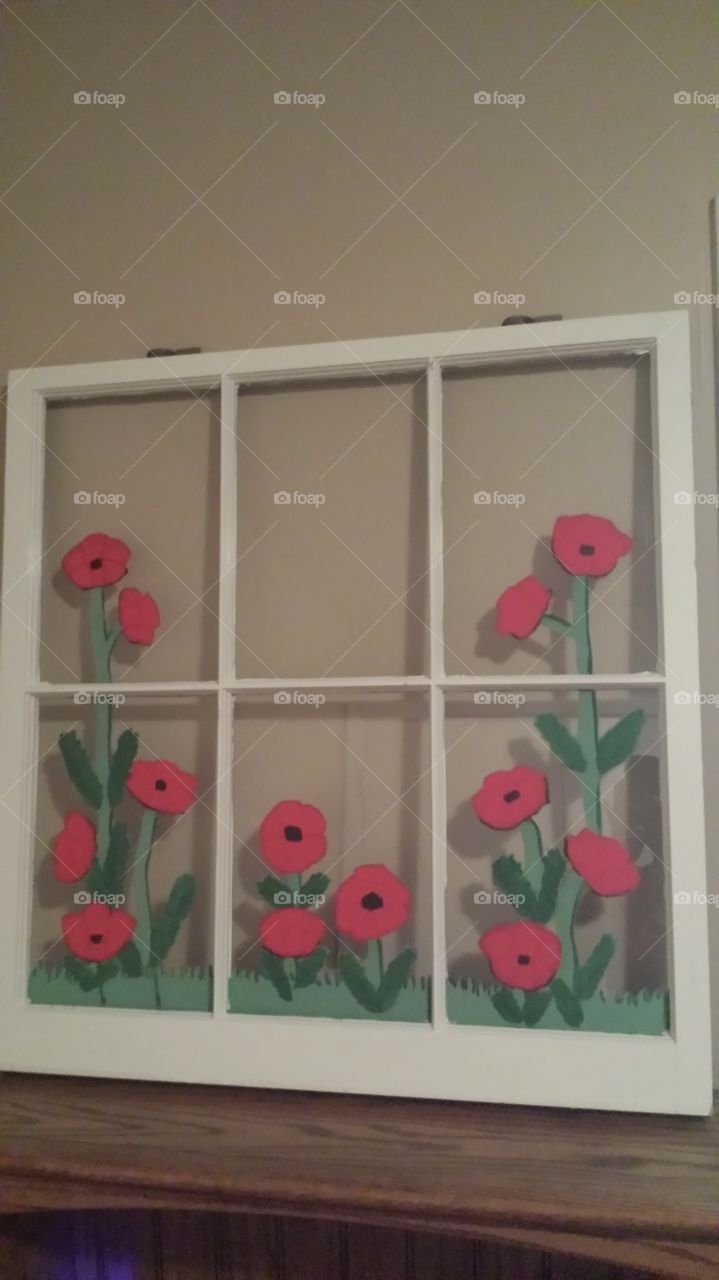 Window Art. Picture of an upcycle wooden window featuring poppies.