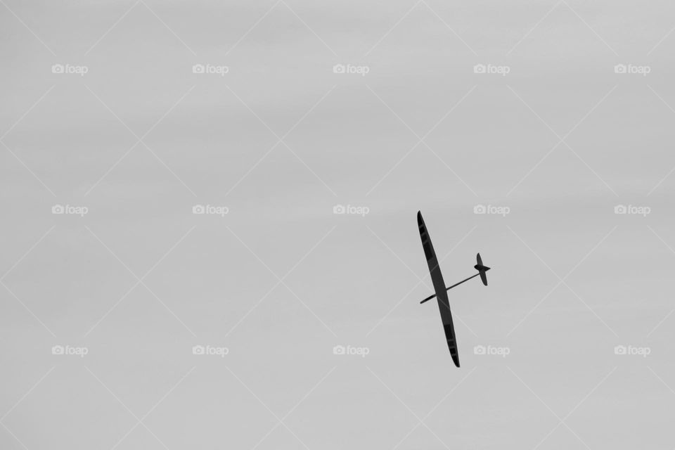 Close up of a model airplane in the sky