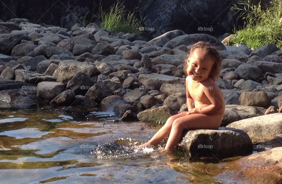 Kid by the stream
