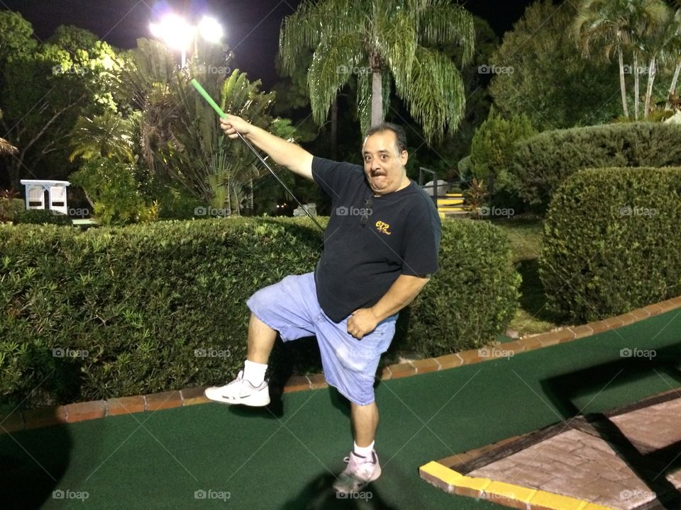 My best captain Morgan pose. While playing mini golf with wife and friends got a hole in one and strike the pose