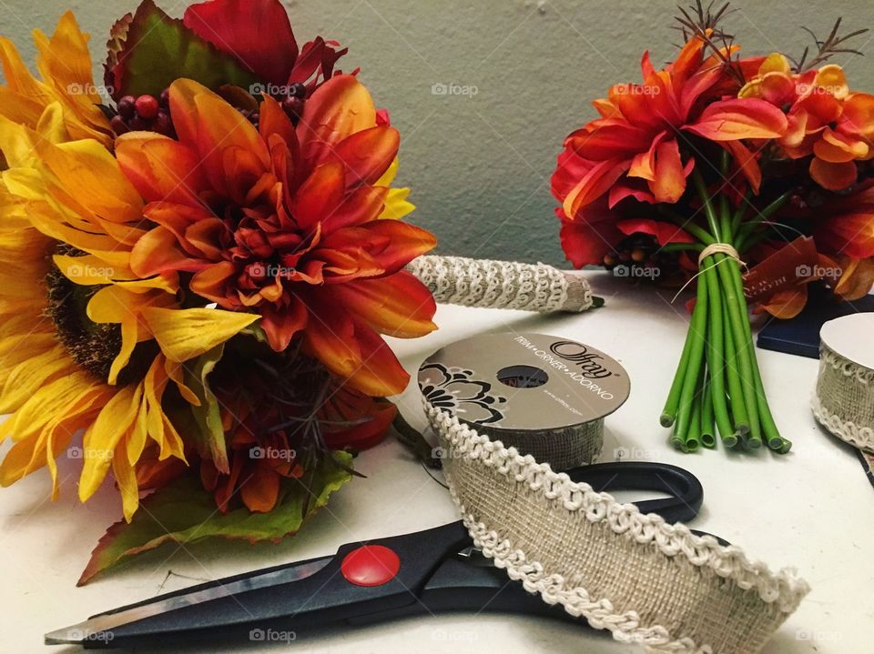 Putting together  bouquets for a fall wedding 