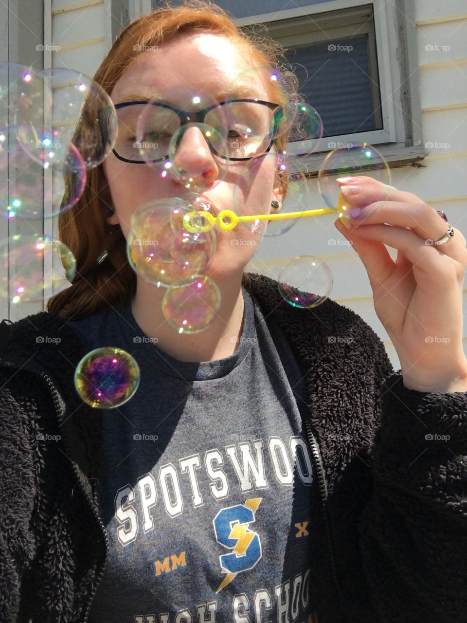 girl blowing bubbles
red hair, blue eyes, glasses, wick