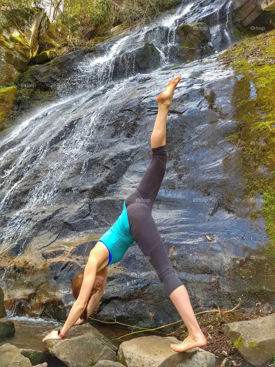 yoga by waterfall