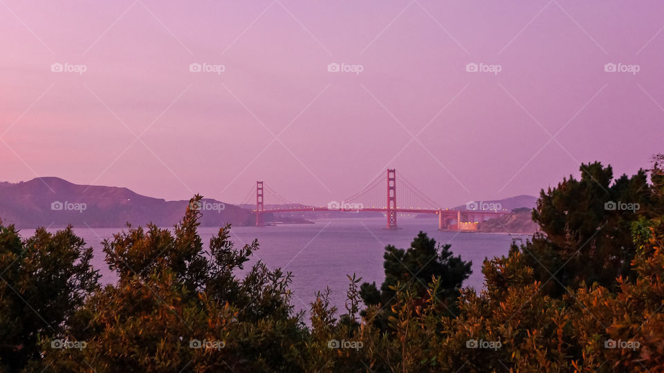 Sunset over west side of Golden Gate Bridge 