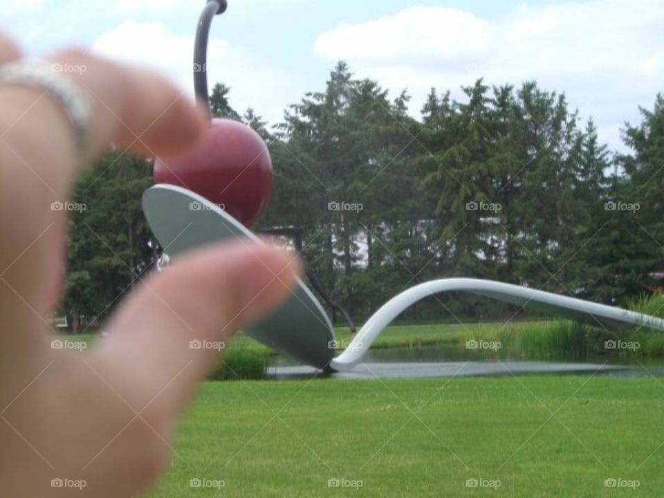 Sculpture garden- cherry on a spoon sculpture