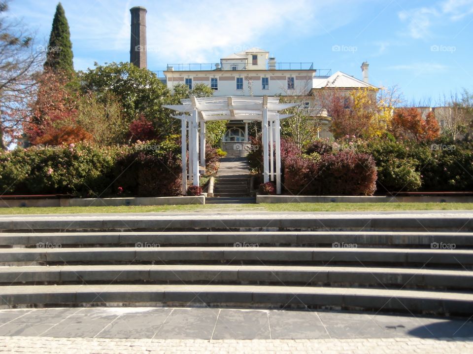 Elegant Entrance. Steps to Estate with Arches and Charm