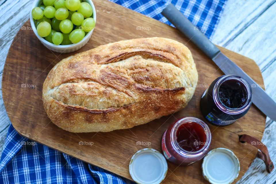 Bread and jam on cutting board