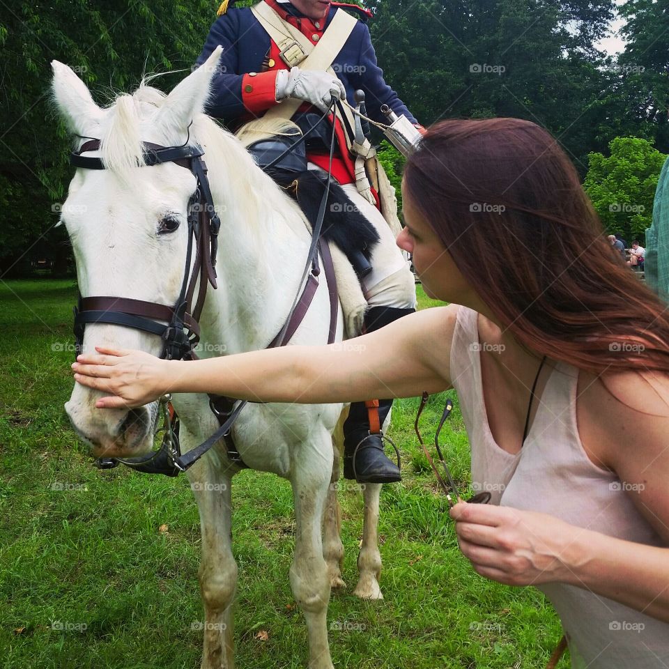 A woman makes a new horsey friend