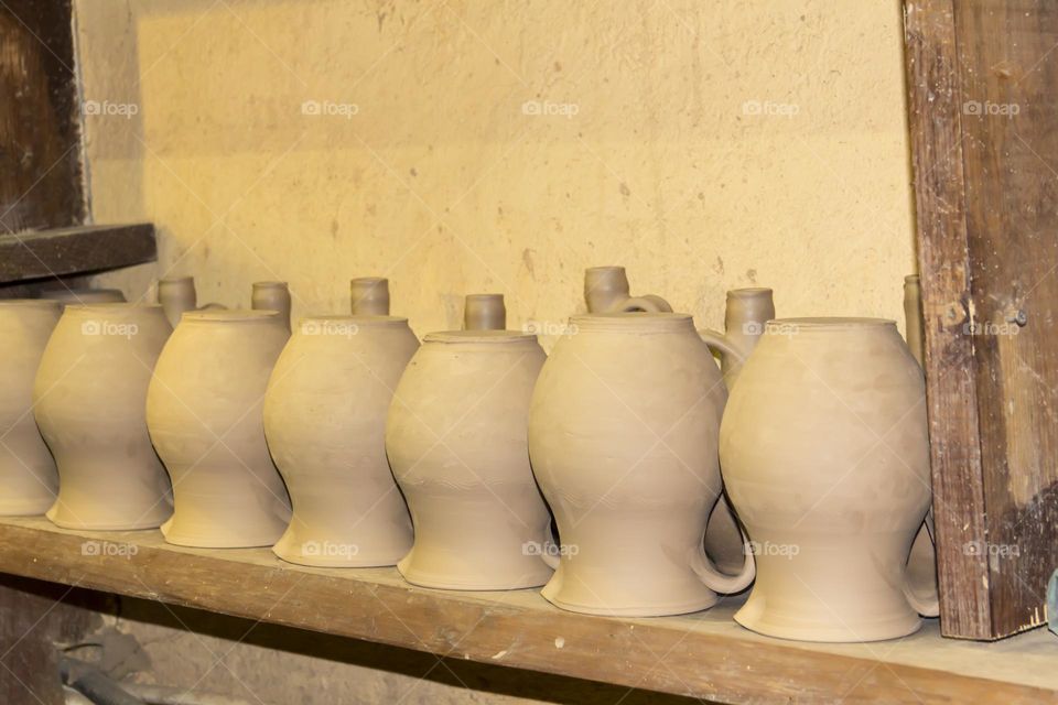 Clay pots in a potter's workshop.  Preservation of the culture and traditions of pottery.